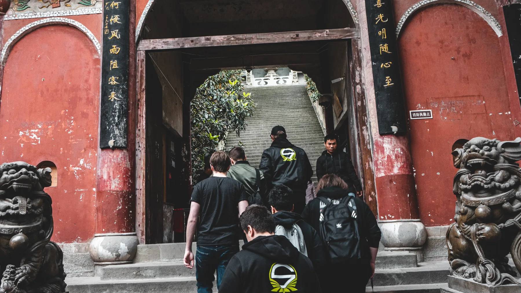 Team Singularity travelling together through a historic gate in China