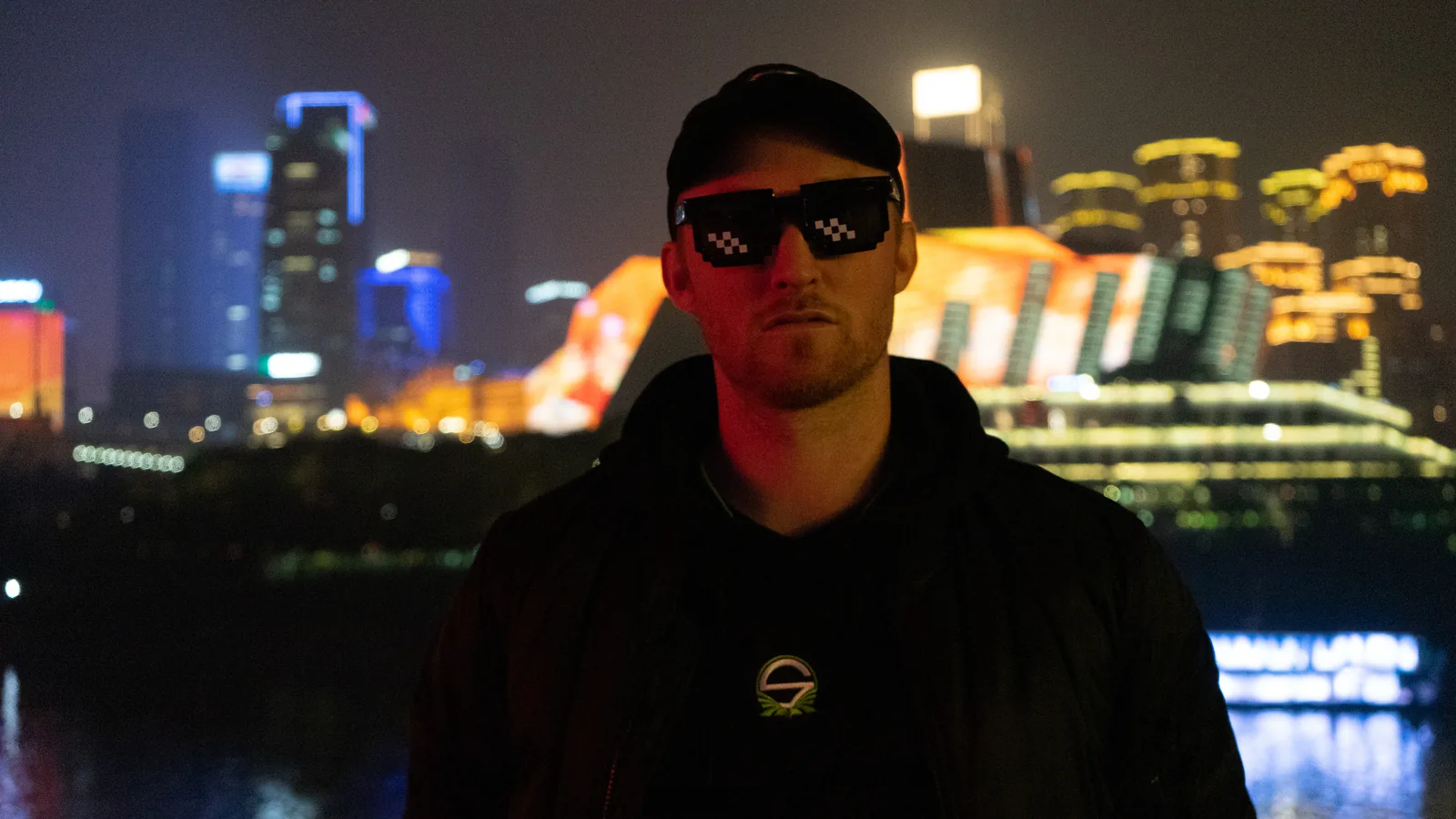 Team Singularity player wearing sunglasses at night during WESG